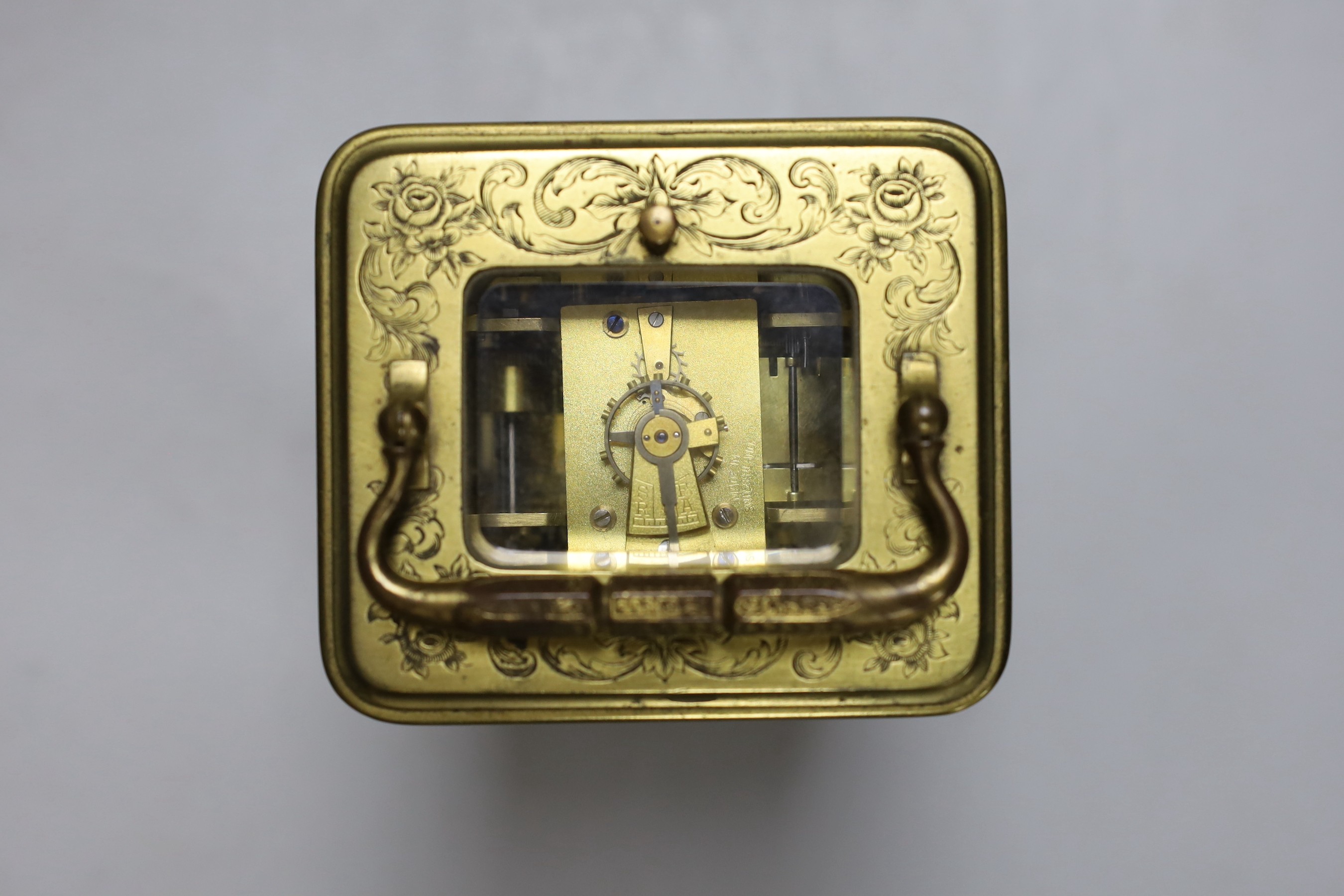 A late 19th century French engraved brass repeating carriage clock with alarm, signed Mottu Freres, Paris, 13cm high
